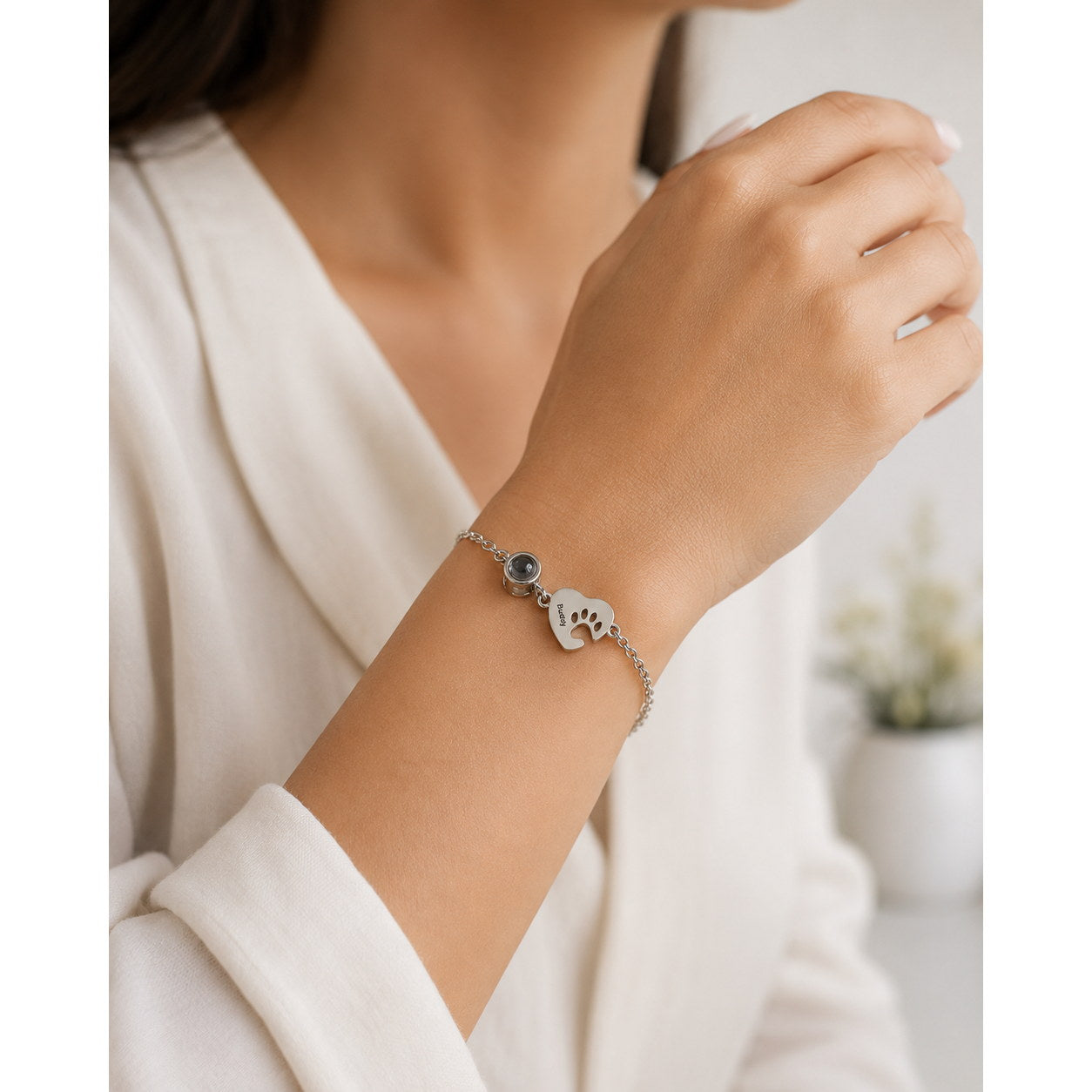 Silver Paw Heart Birthstone Bracelet worn on wrist