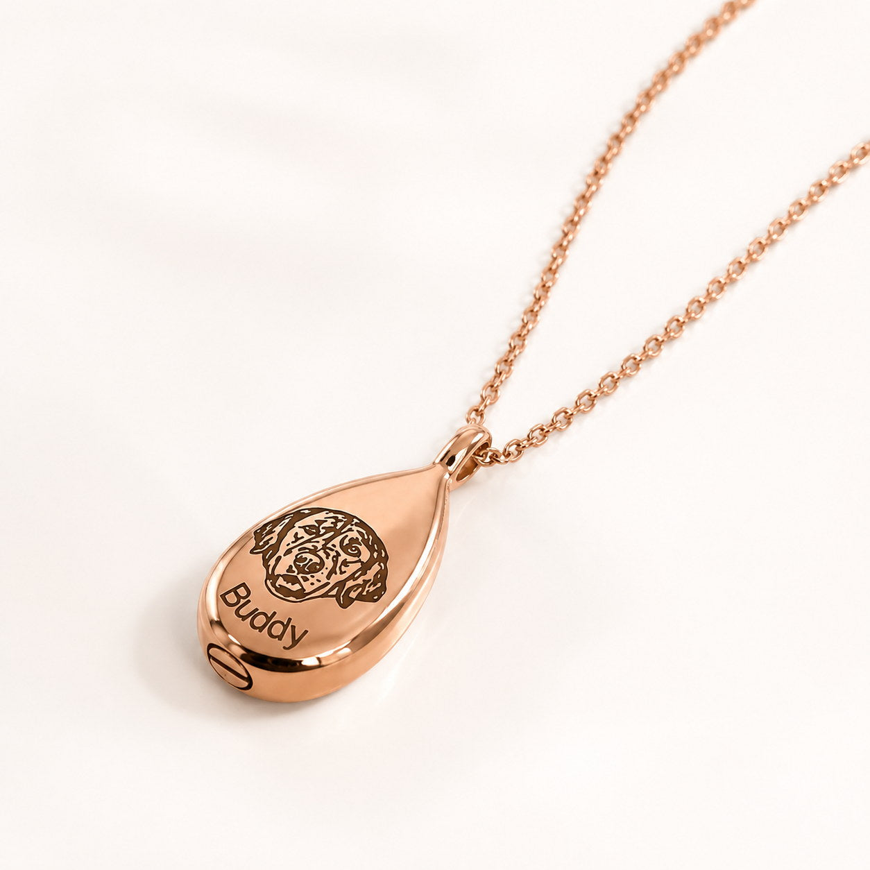 Rose gold Teardrop Memorial Urn Necklace close-up with pet portrait and Buddy engraving
